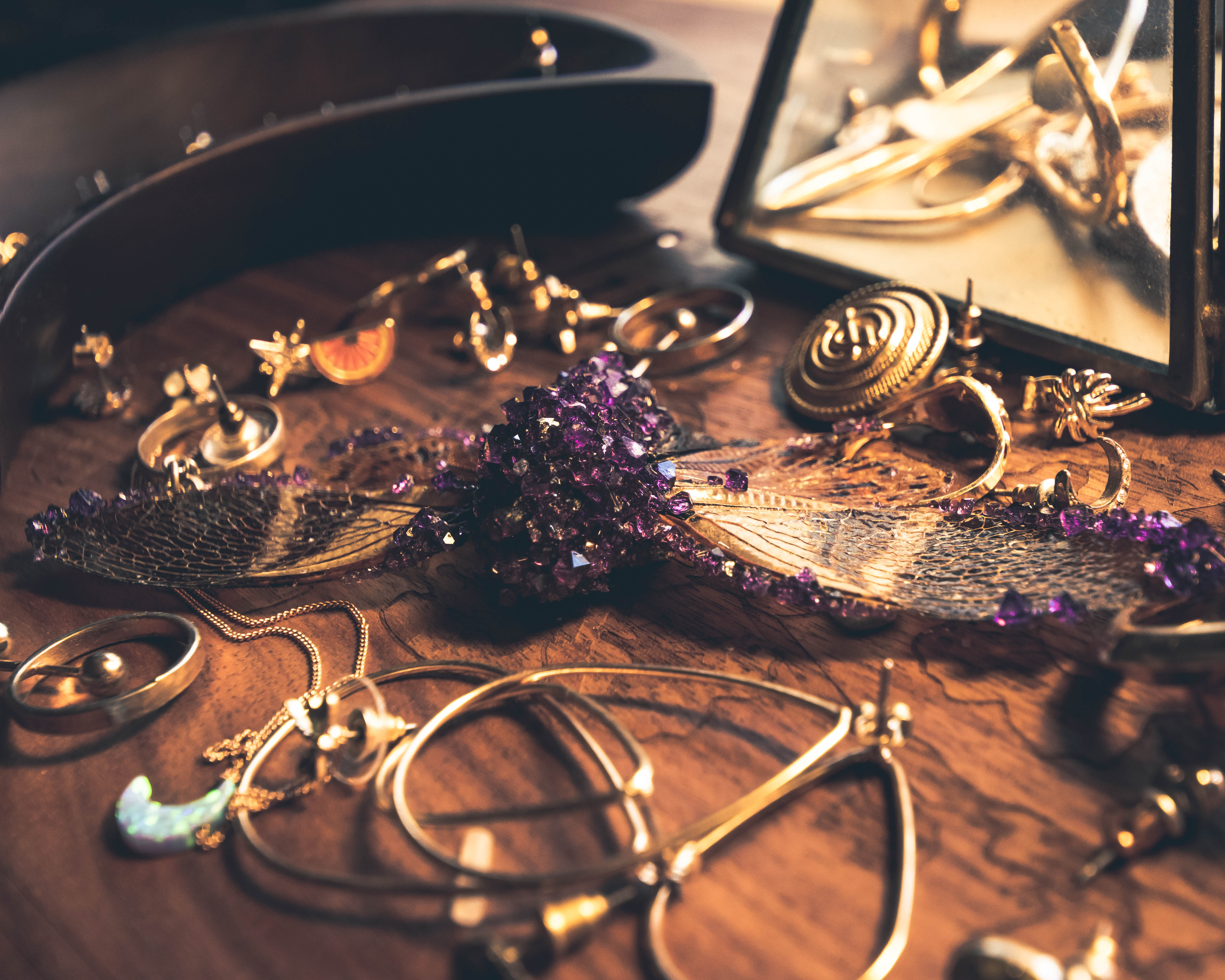 Closeup of the golden jewelry and decorations on the table. stock photo