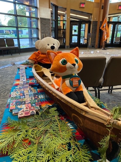 Echo and Spirit Bear in a Birch Bark Canoe