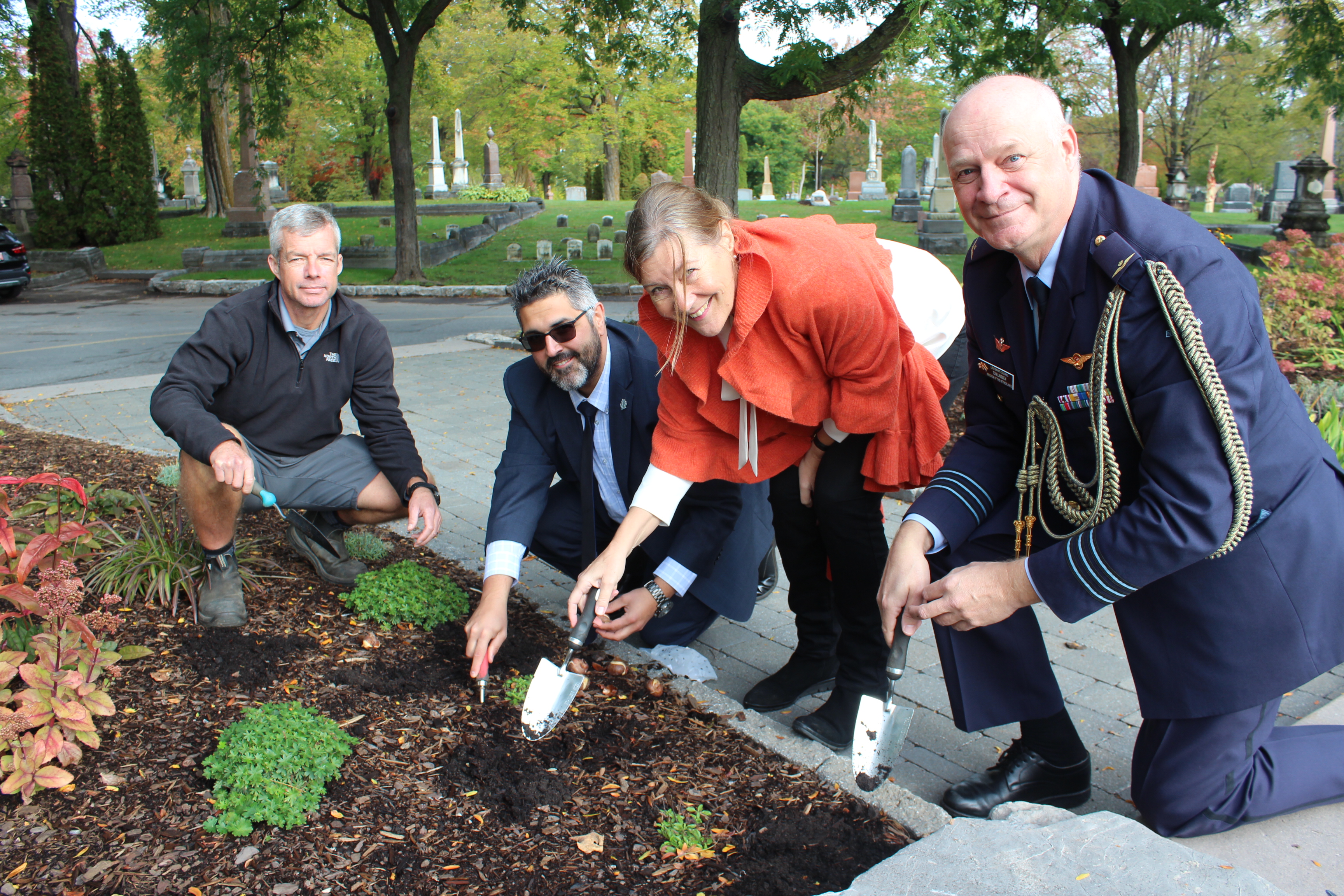 Ambassador Ines Coppoolse and Defense Attaché Ton Linssen from the Embassy of the Kingdom of the Netherlands to Canada, alongside Beechwood Cemetery’s Chief Horticulturalist, Trevor Davidson, and Nick McCarthy
