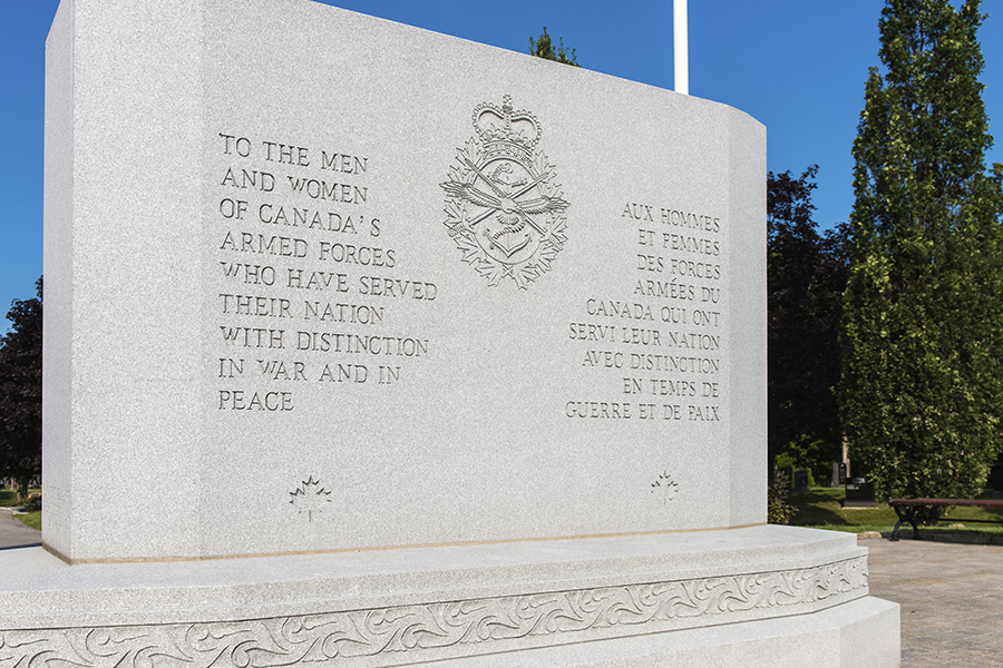 The Beechwood National Military Cemetery central memorial with text saluting the service of armed forces members in times of peace and war.