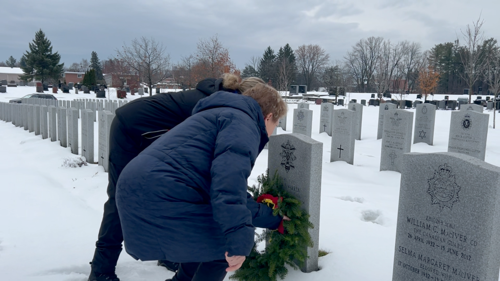 Debbie Warren and her family lay a wreath on her son Jason’s grave at the Wreaths Across Canada ceremony. (Jackie Perez/CTV News Ottawa)