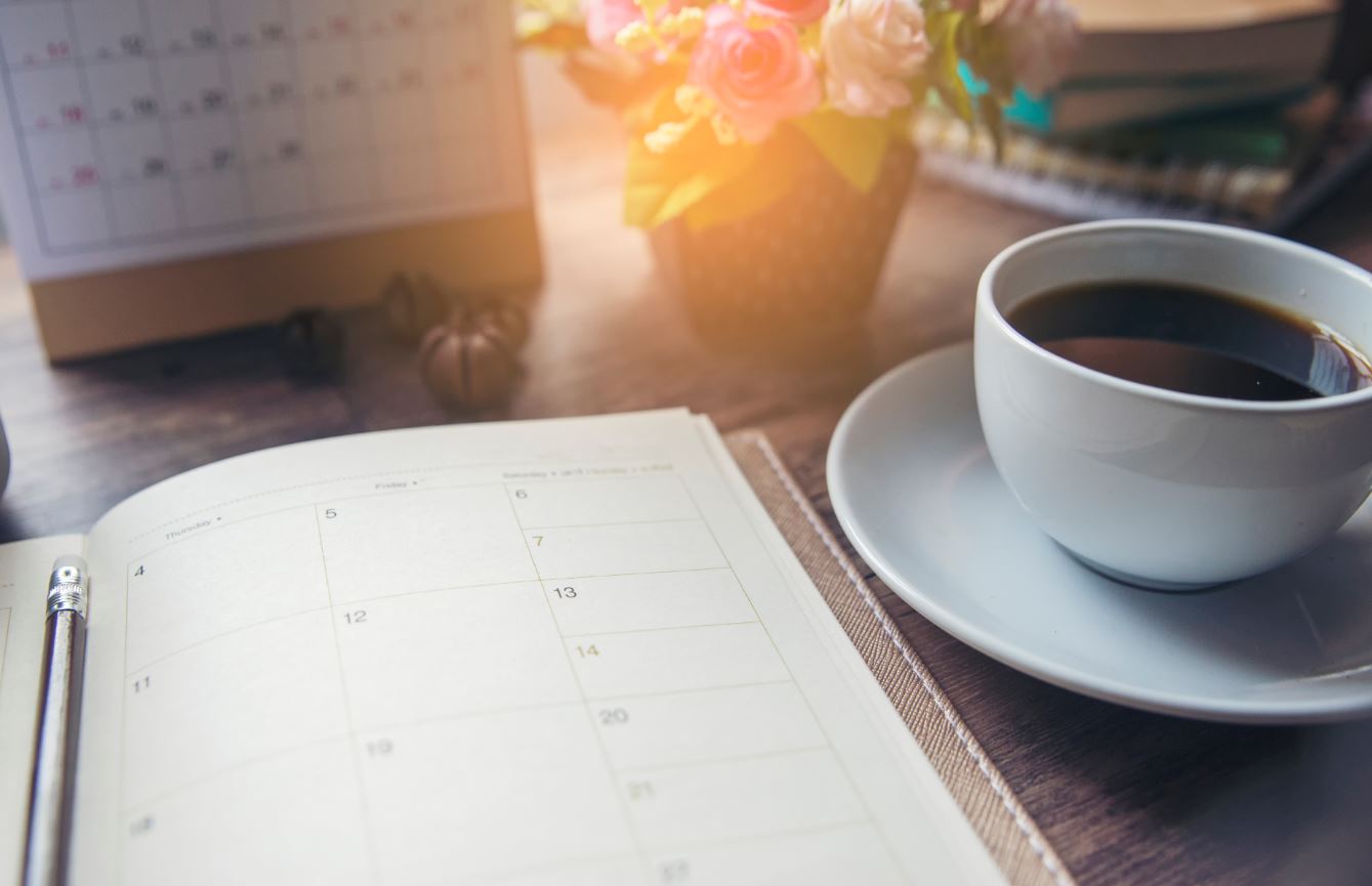 Calendar with coffee cup.